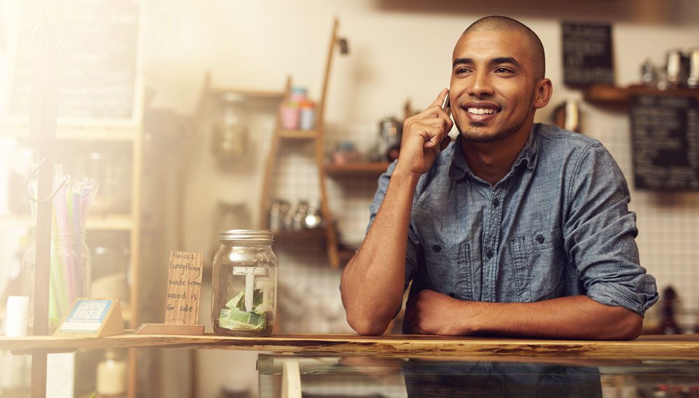 Business owner answering a call on a mobile phone